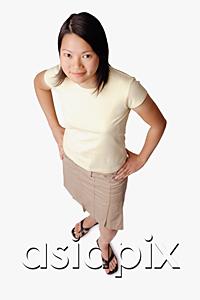 AsiaPix - Young woman looking at camera, hands on hips