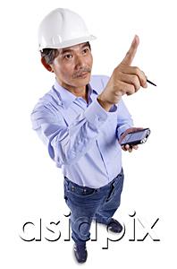 AsiaPix - Mature man wearing construction hat, holding PDA, pointing