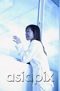 AsiaPix - Woman leaning on ledge, touching window, looking out