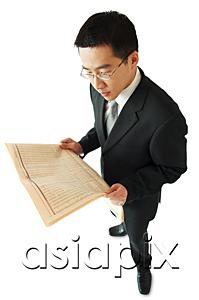 AsiaPix - Businessman reading newspaper