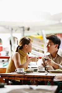 AsiaPix - Couple dining in cafe, drinks in hand