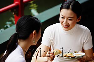 AsiaPix - Women in cafe, eating