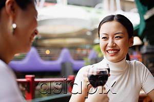 AsiaPix - Women holding glasses of wine, toasting
