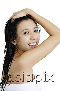 AsiaPix - Woman with wet hair, wrapped in a towel, looking over shoulder, hand on head