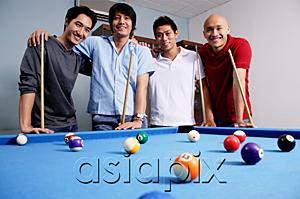 AsiaPix - Men standing around pool table, looking at camera