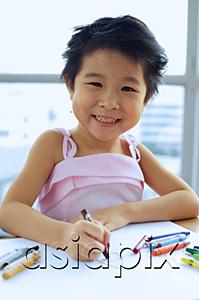 AsiaPix - Young girl with crayons, smiling at camera