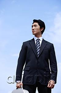 AsiaPix - Businessman with briefcase, looking away