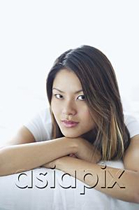 AsiaPix - Woman looking at camera, lying on front, arms crossed