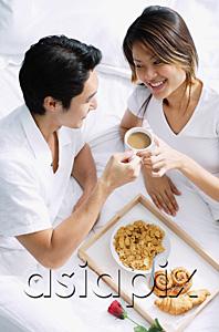 AsiaPix - Couple on bed, having breakfast