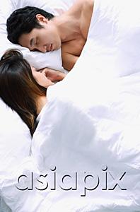 AsiaPix - Couple sleeping side by side on bed
