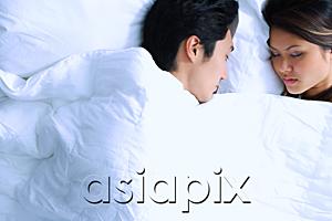 AsiaPix - Couple sleeping on bed