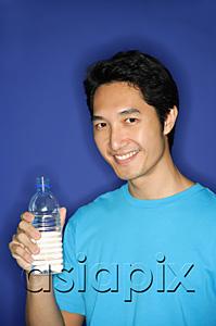 AsiaPix - Man holding bottle of water