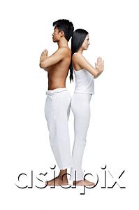 AsiaPix - Couple doing yoga position, standing back to back
