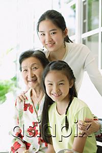 AsiaPix - Grandmother sitting with her granddaughters
