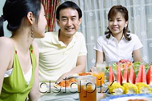 AsiaPix - Family with teenage daughter at dining table