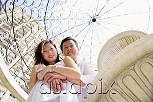 AsiaPix - Couple looking at down camera