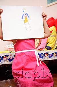 AsiaPix - Young girl holding drawing over face