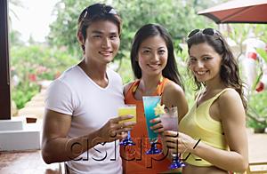 AsiaPix - Young adults holding drinks looking at camera