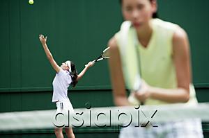 AsiaPix - Women playing tennis together