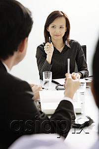 AsiaPix - Businesswoman and businessman having a discussion in a meeting