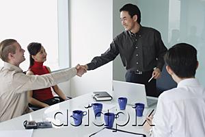 AsiaPix - Executives in meeting room, two men shaking hands