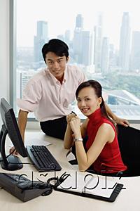 AsiaPix - Executives in office looking camera