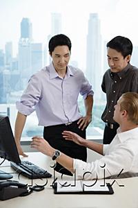 AsiaPix - Male executives in office, having a discussion