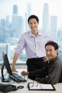AsiaPix - Male executives in office, smiling at camera