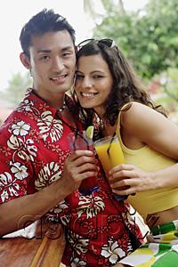 AsiaPix - Couple side by side, holding drinks, looking at camera