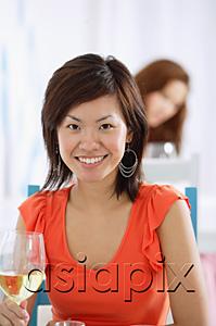 AsiaPix - One woman holding wine glass, looking at camera