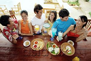 AsiaPix - Young adults at beach bar, high angle view