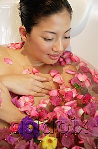 AsiaPix - Woman in bathtub, flowers floating in water