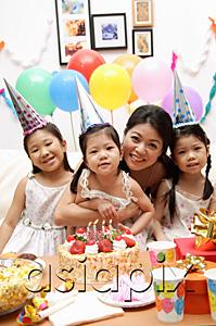 AsiaPix - Mother with three girls celebrating a birthday
