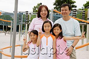 AsiaPix - Family at playground, smiling at camera