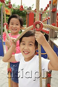 AsiaPix - Two girls in playground, looking at camera