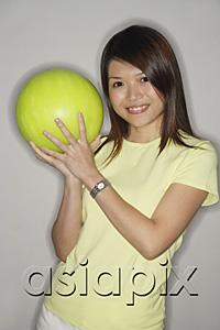 AsiaPix - Woman holding bowling ball, smiling at camera