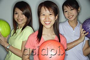 AsiaPix - Three young women holding bowling balls, smiling at camera