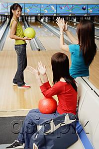 AsiaPix - Women in bowling alley, cheering friend on