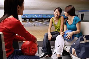 AsiaPix - Women sitting in bowling alley