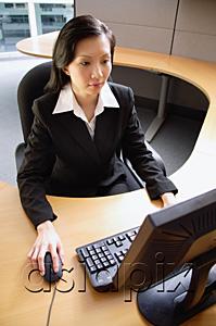 AsiaPix - Businesswoman using computer