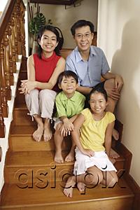 AsiaPix - Family sitting on stairs, smiling at camera, portrait