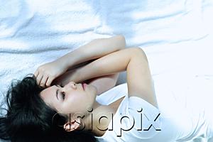 AsiaPix - Young woman lying on side