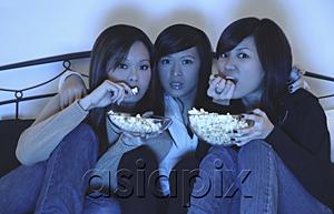 AsiaPix - Three girls in bedroom, eating popcorn, watching TV