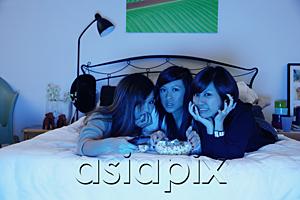 AsiaPix - Three girls in bedroom, lying on bed, watching TV
