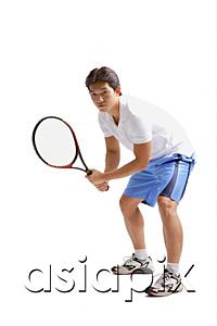 AsiaPix - Young man holding tennis racket