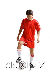 AsiaPix - Young man in soccer uniform with soccer ball