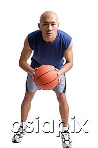AsiaPix - Young man holding basketball