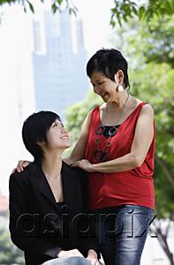 AsiaPix - Mother and adult daughter looking at each other