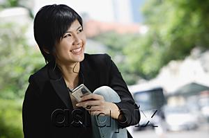 AsiaPix - Woman listening to MP3 player