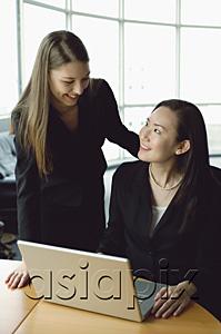 AsiaPix - Businesswomen in front of laptop